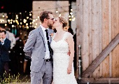 Couple in front of barn doors