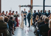 Couple getting married under arch